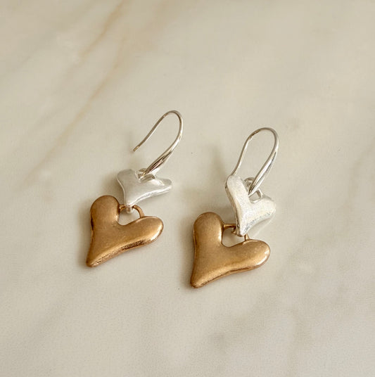 Silver plated and faux gold worn finish double heart drop earrings