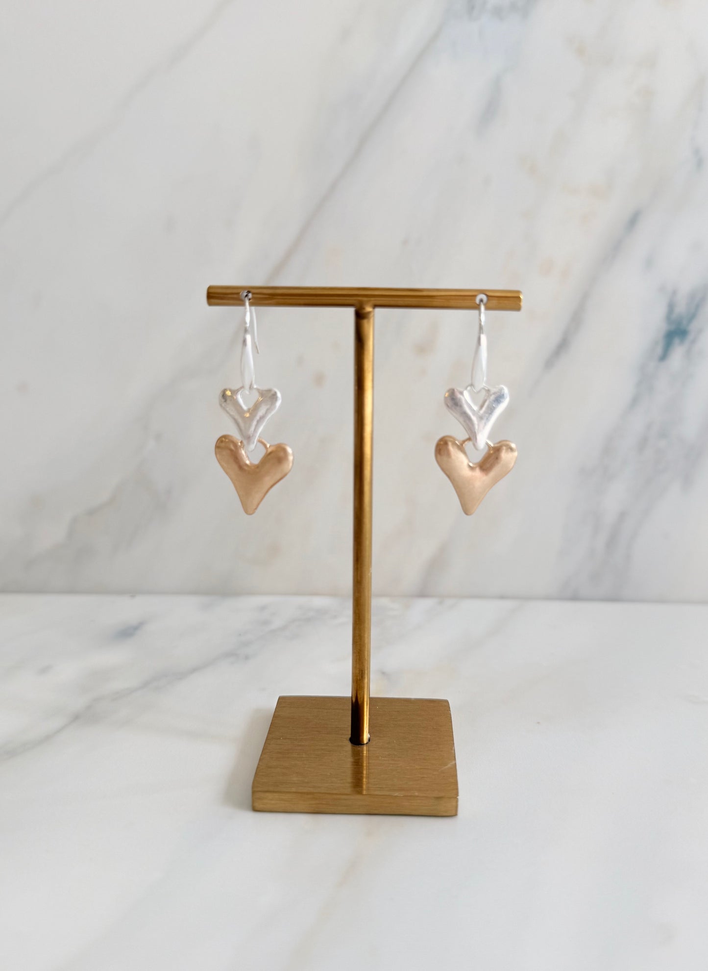 Silver plated and faux gold worn finish double heart drop earrings