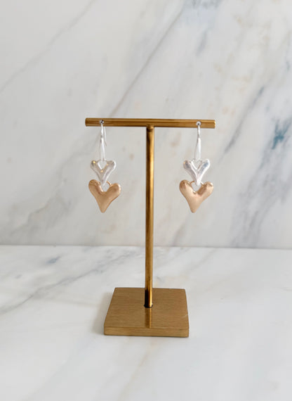 Silver plated and faux gold worn finish double heart drop earrings