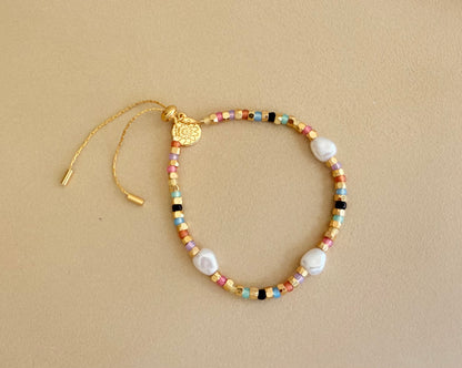 Faux gold and pastel bracelet with pearls