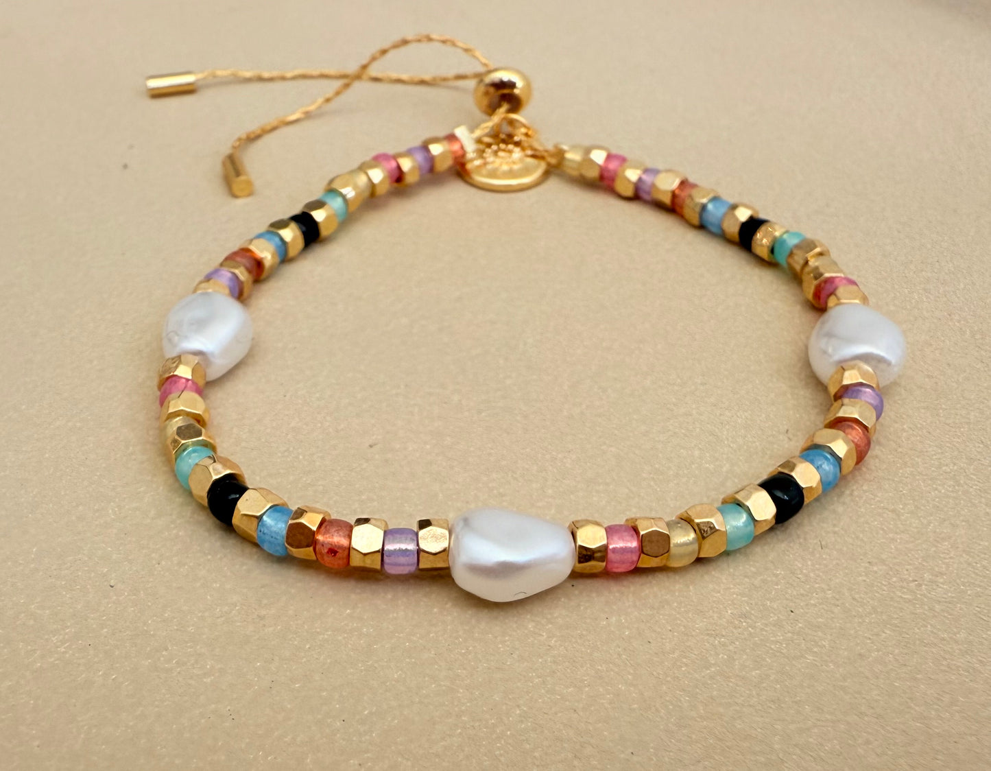 Faux gold and pastel bracelet with pearls