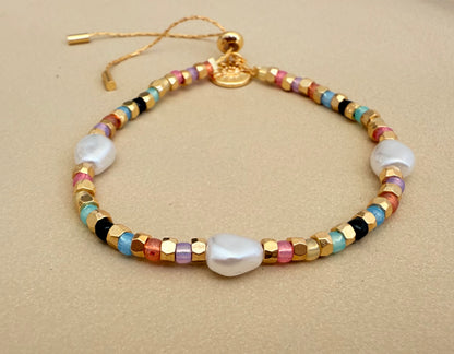 Faux gold and pastel bracelet with pearls