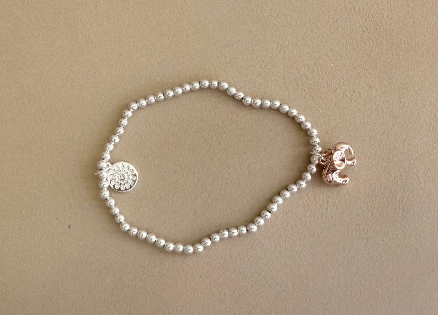 Silver plated stretch bracelet with daisy and heart charms